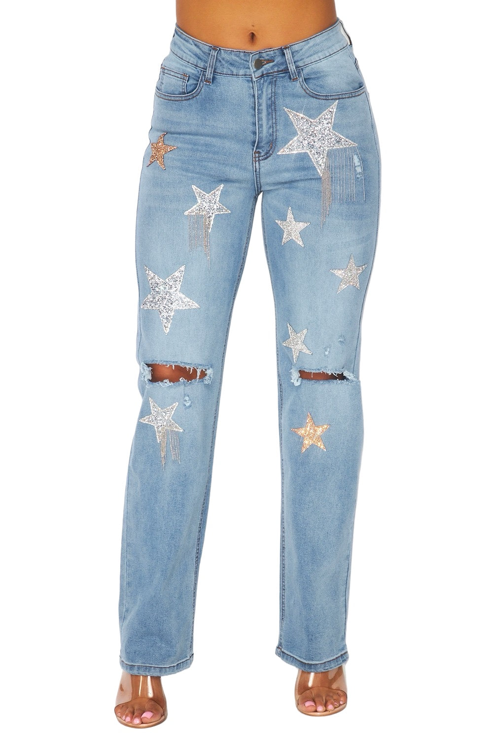 a woman wearing blue jeans with stars on them