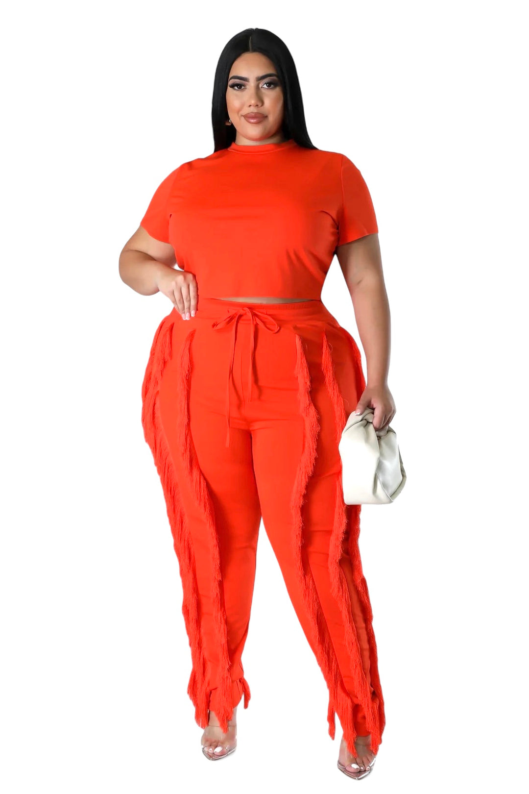 a woman in an orange top and pants