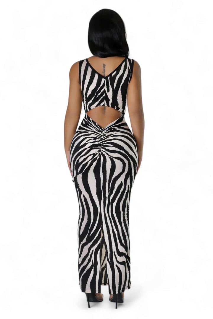 a woman in a zebra print dress