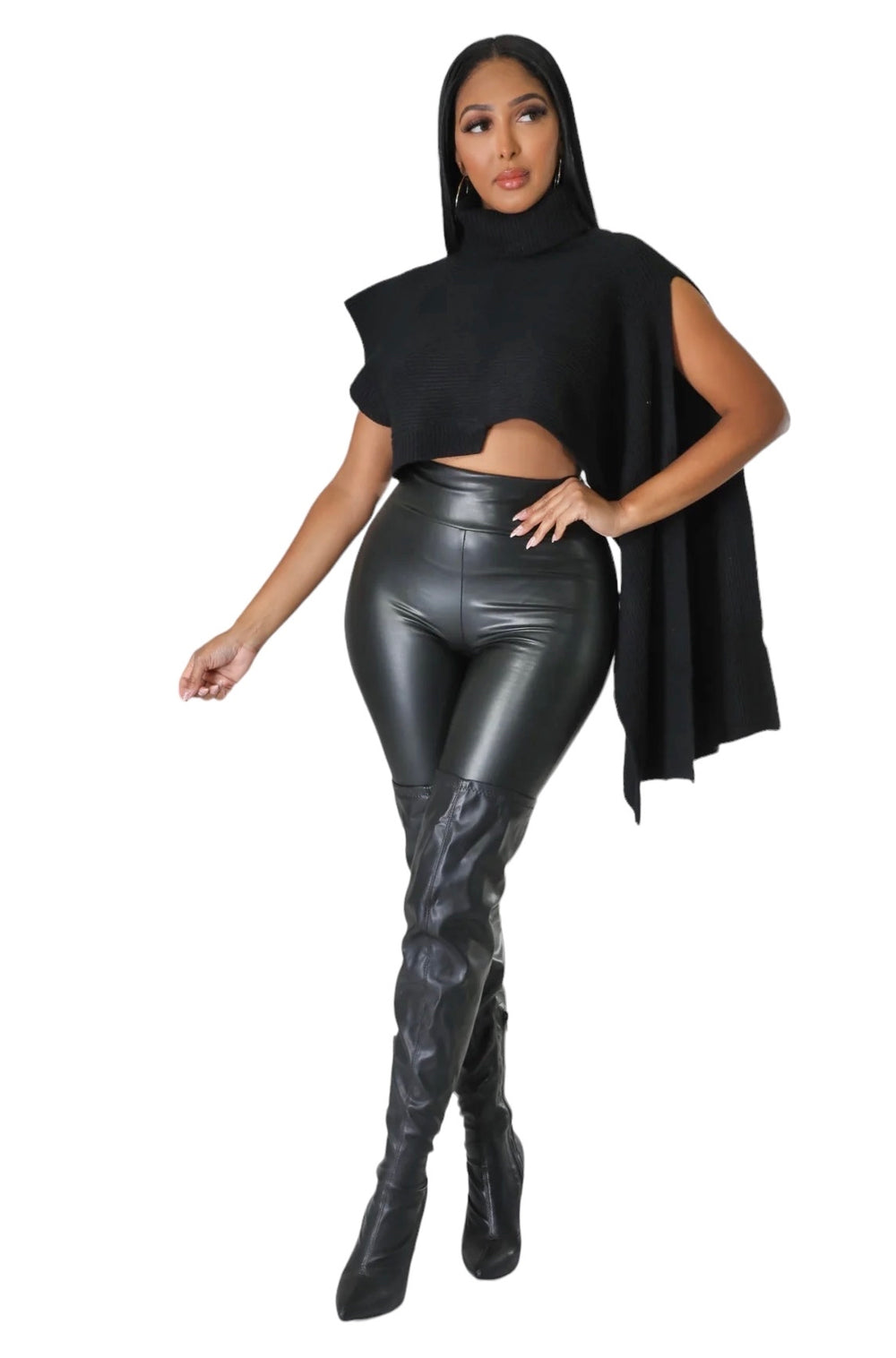 a woman in a black top and leather pants