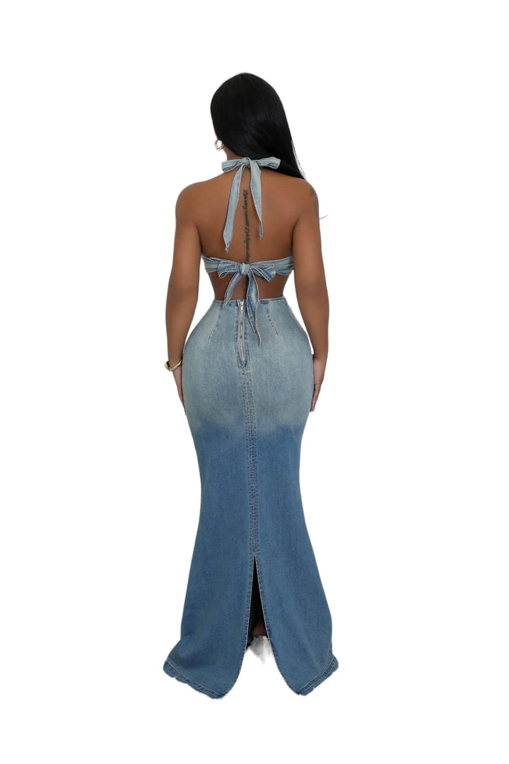 the back of a woman wearing a denim dress