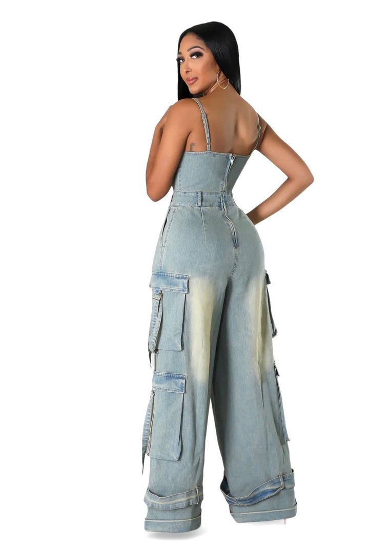 a woman wearing a denim jumpsuit with straps