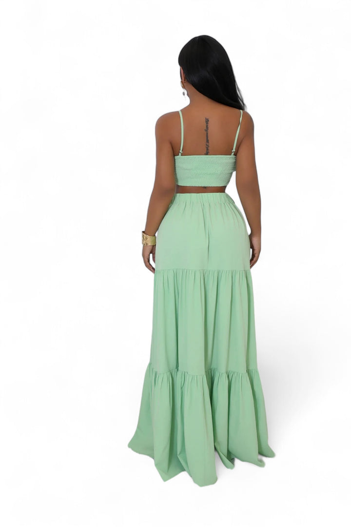 the back of a woman wearing a green dress