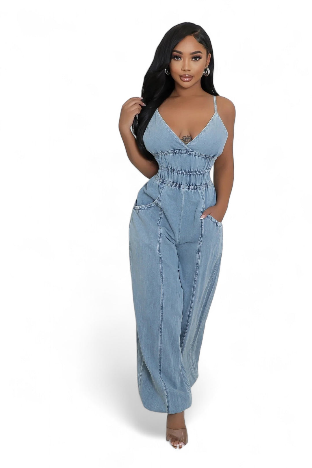 a woman wearing a denim jumpsuit