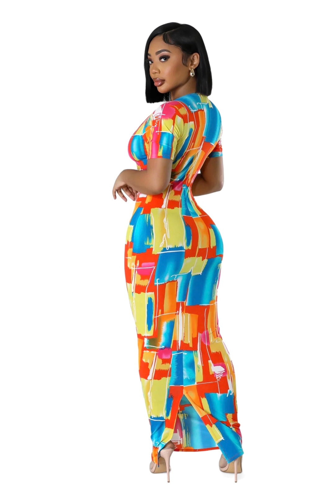 a woman in a colorful dress posing for a picture