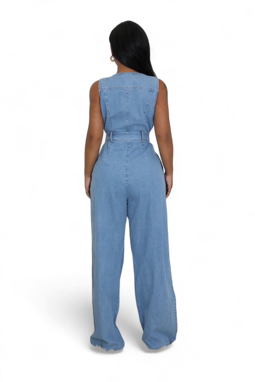 a woman wearing a denim jumpsuit