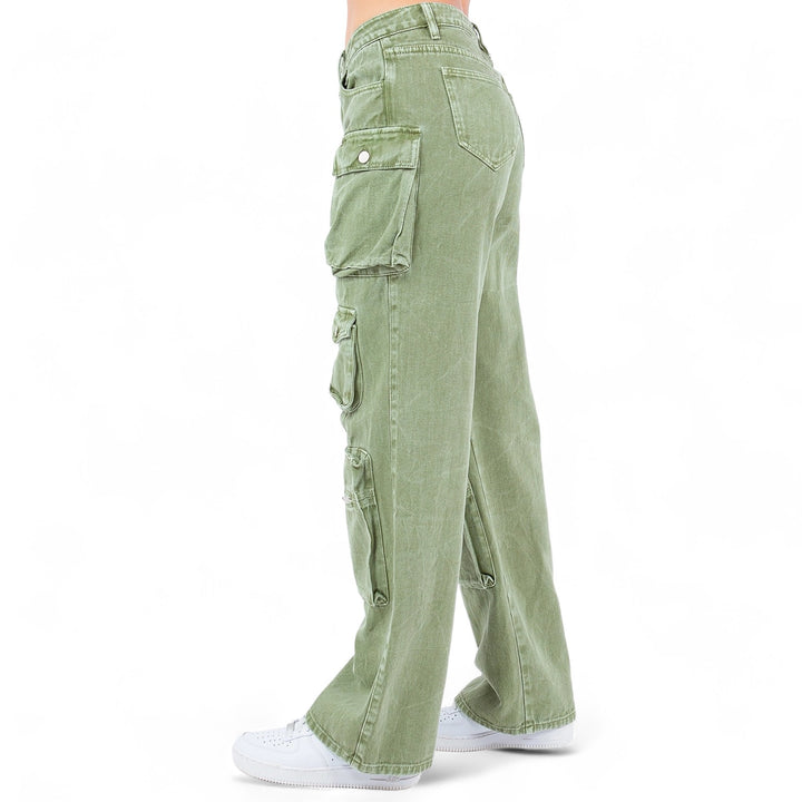 a person wearing green pants and white shoes