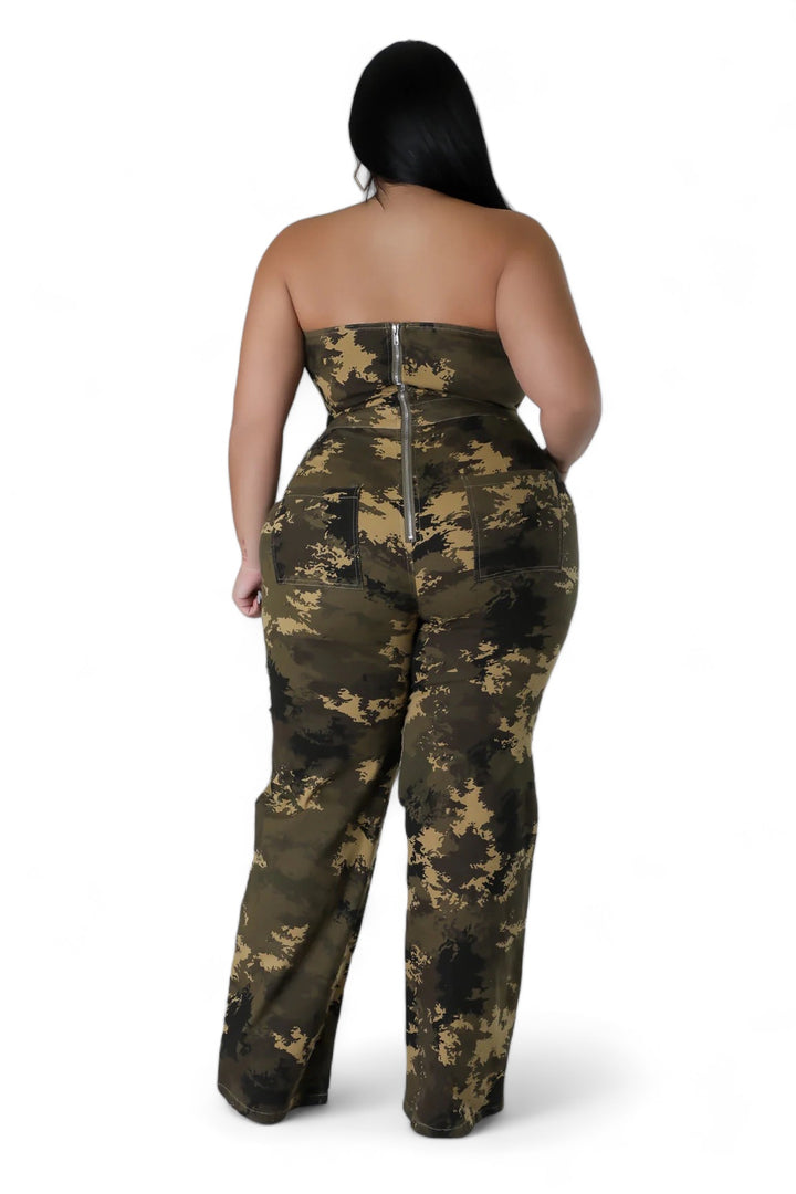 a woman in a camo print jumpsuit