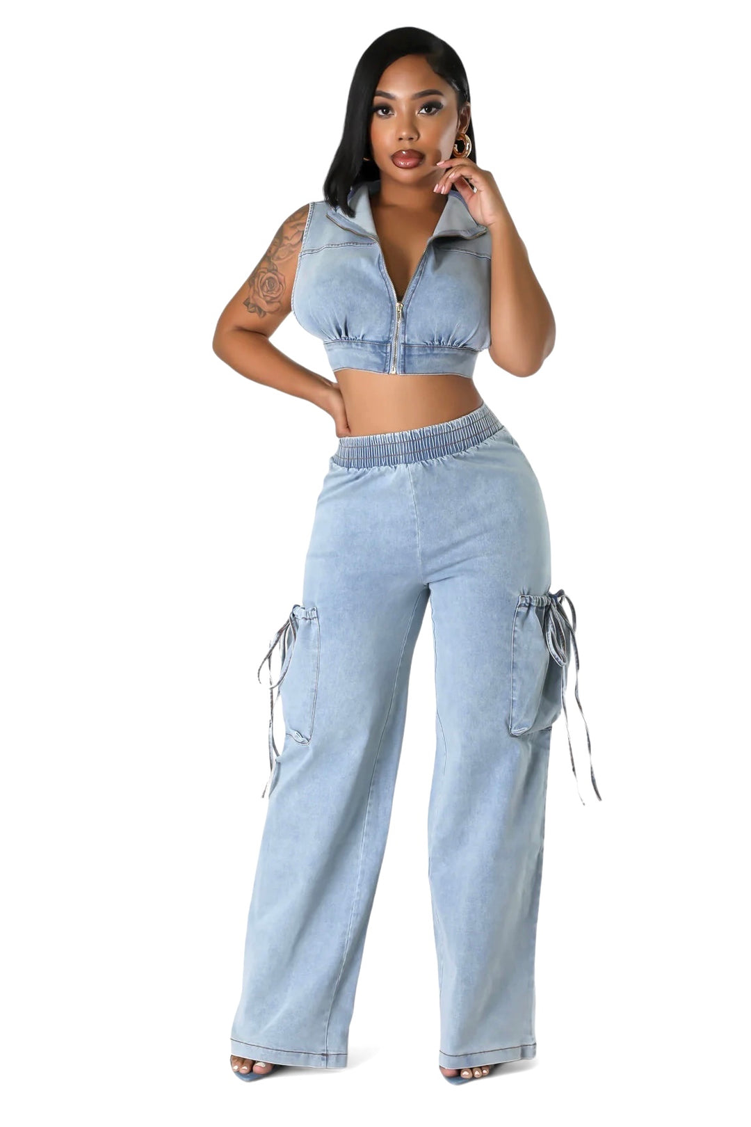 a woman in a crop top and jeans posing for a picture