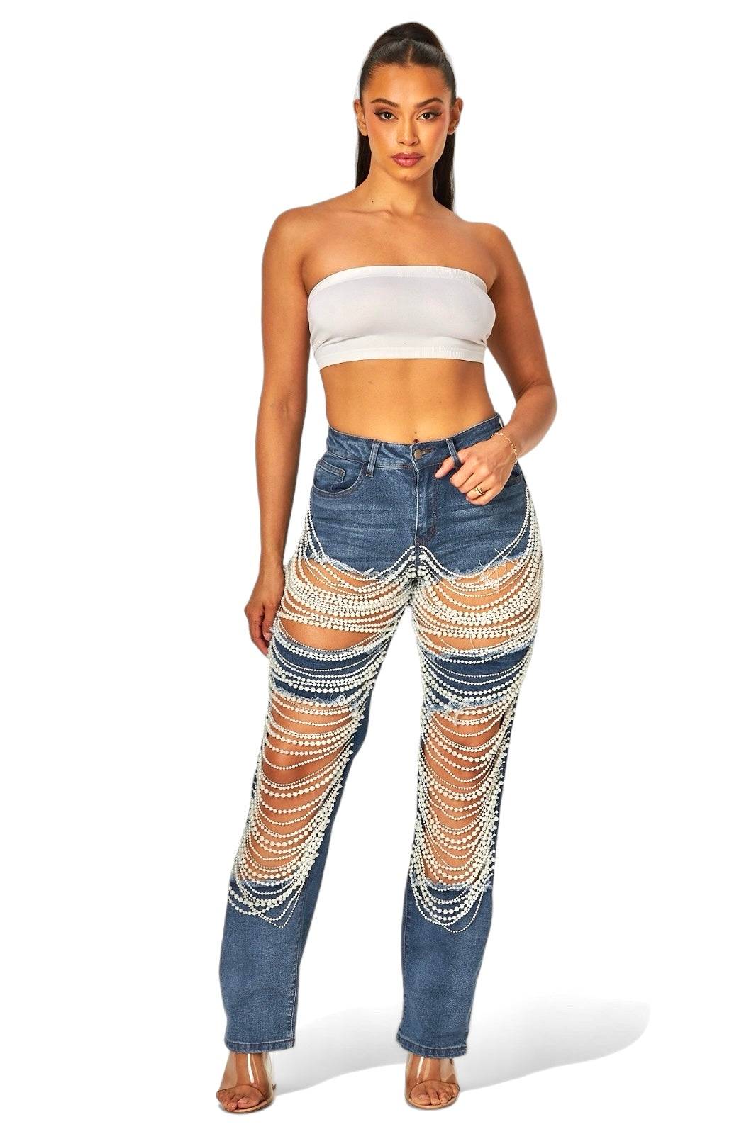 a woman wearing a crop top and jeans