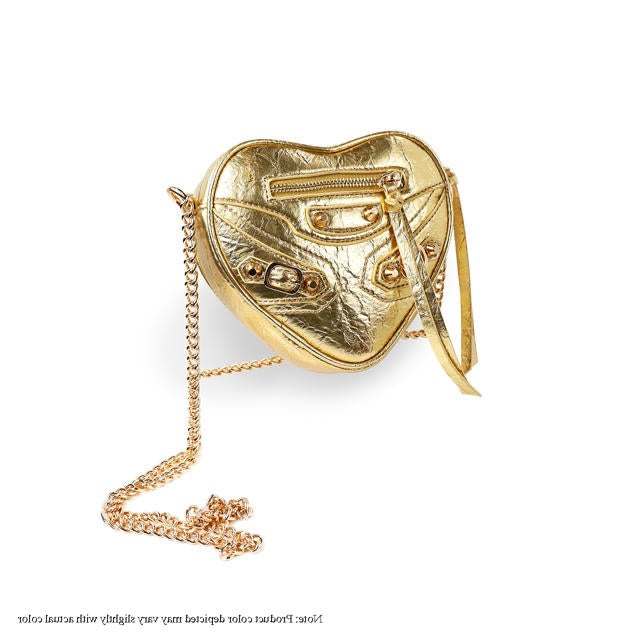 a gold purse with a chain attached to it