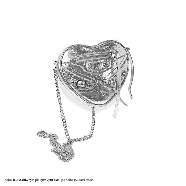 a heart shaped box with a chain attached to it