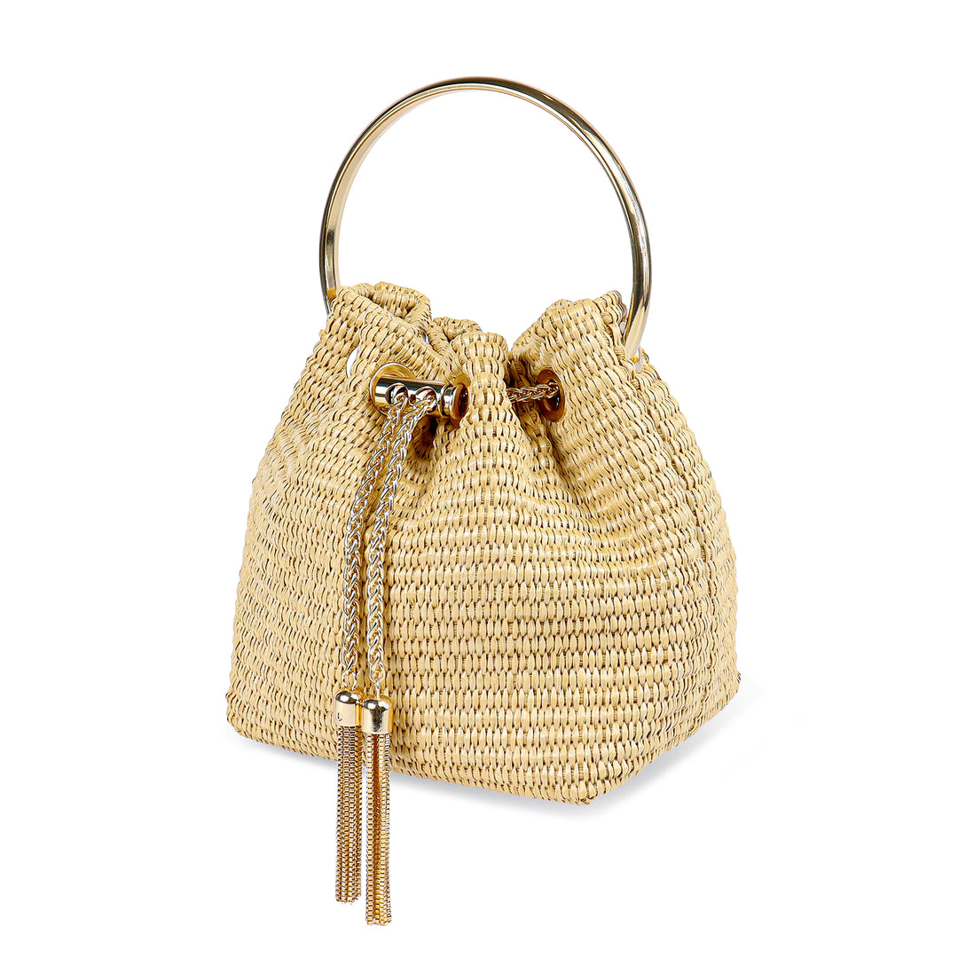 a straw bag with a metal ring handle