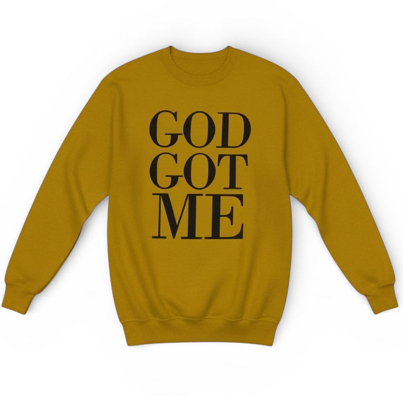 Mustard yellow sweatshirt with 'GOD GOT ME' text on a white background