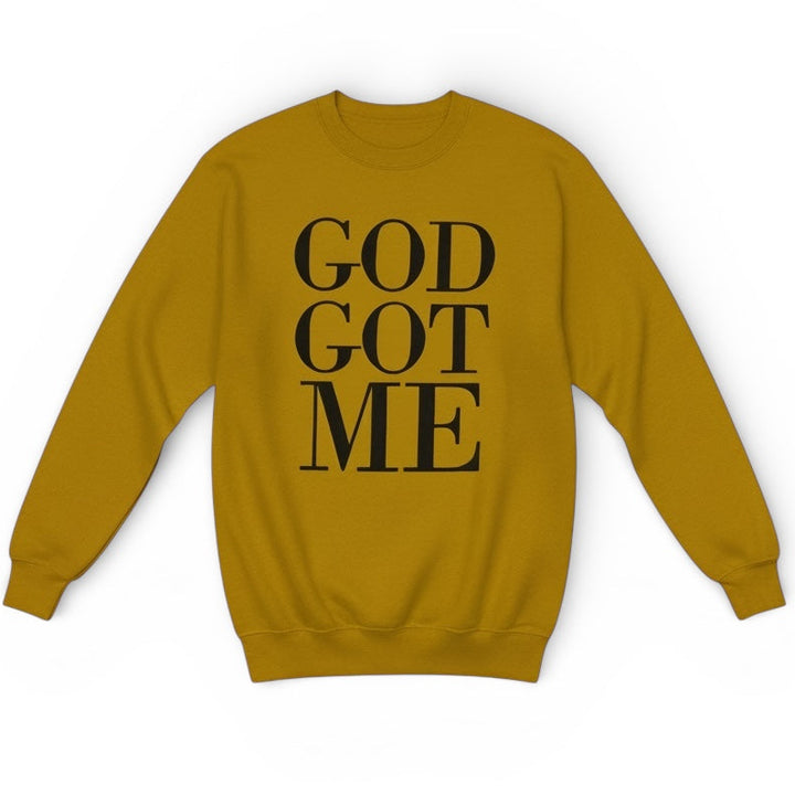 Mustard yellow sweatshirt with 'GOD GOT ME' text on a white background