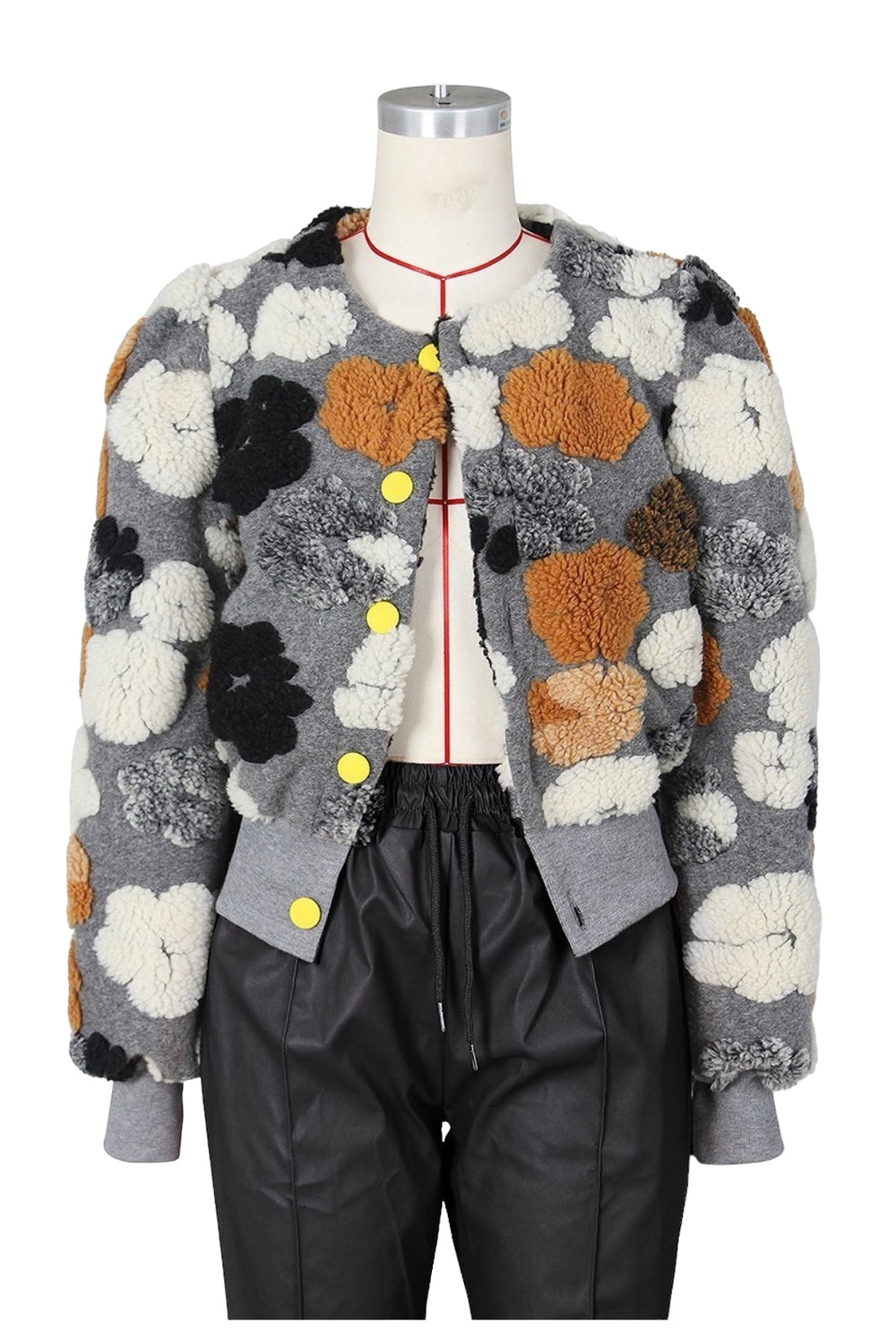 a mannequin wearing a jacket with flowers on it