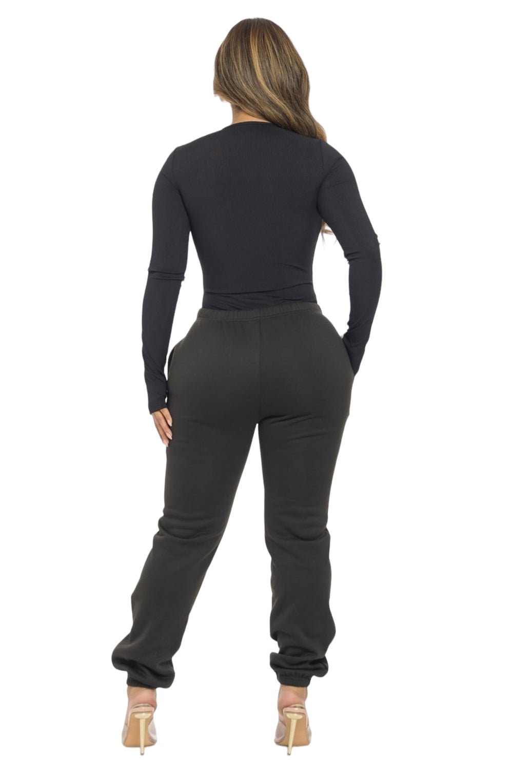 a woman in a black top and pants