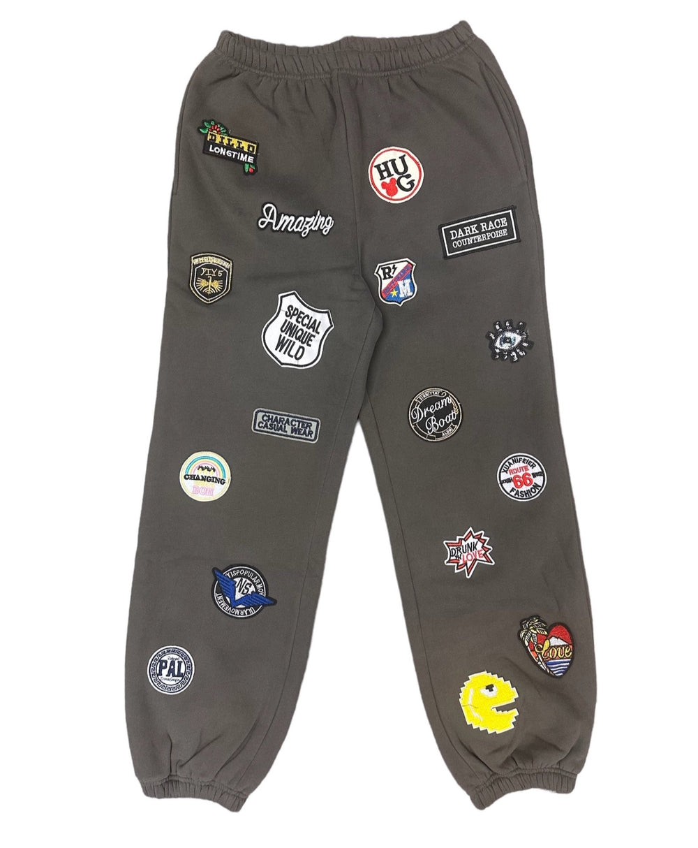 a pair of grey pants with patches on them