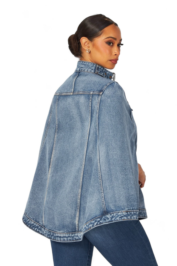 a woman wearing a denim jacket and jeans