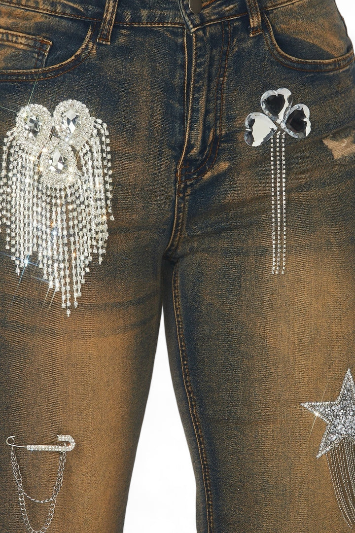 the back of a pair of jeans with chains and stars on them