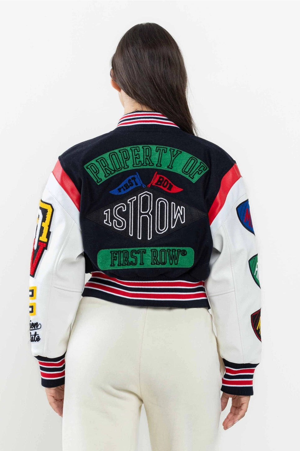 Model back view in varsity jacket with bold text design