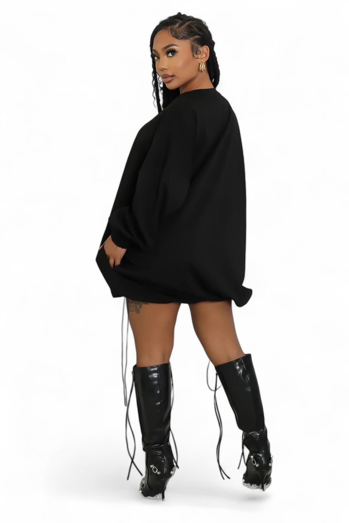 Black oversized pullover dress with drawstrings, back view