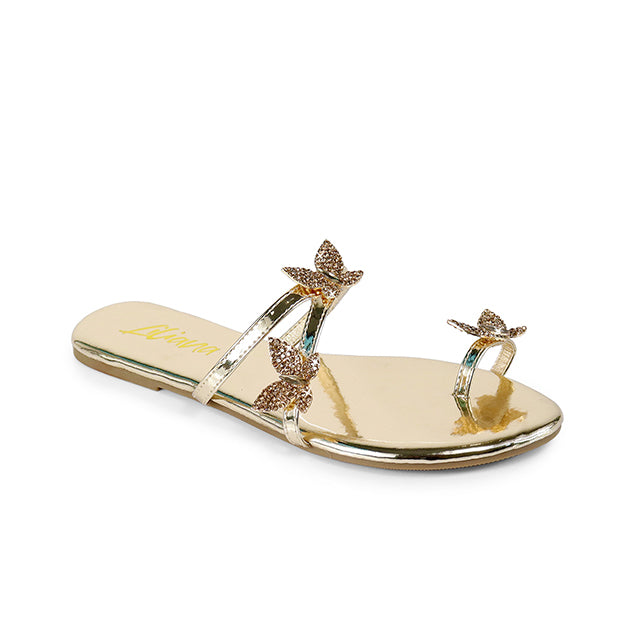 a women's gold sandal with a butterfly decoration