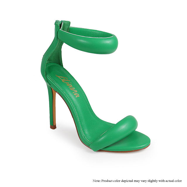 a pair of green high heeled shoes on a white background
