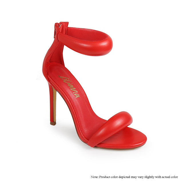 a pair of red high heeled shoes on a white background
