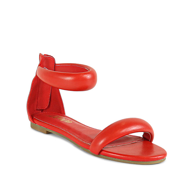 a woman's red sandals on a white background