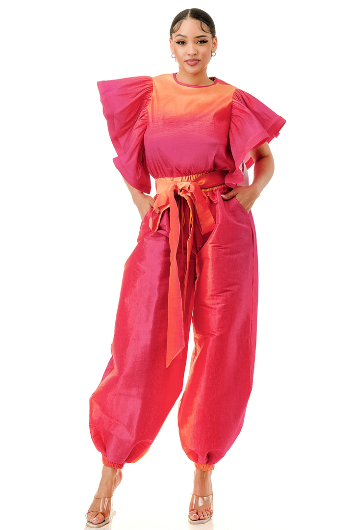 a woman in a pink and orange outfit