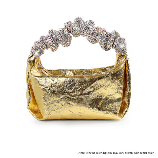 a gold purse with a diamond clasp