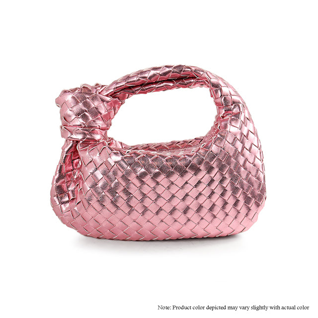 a pink purse with a bow on the handle