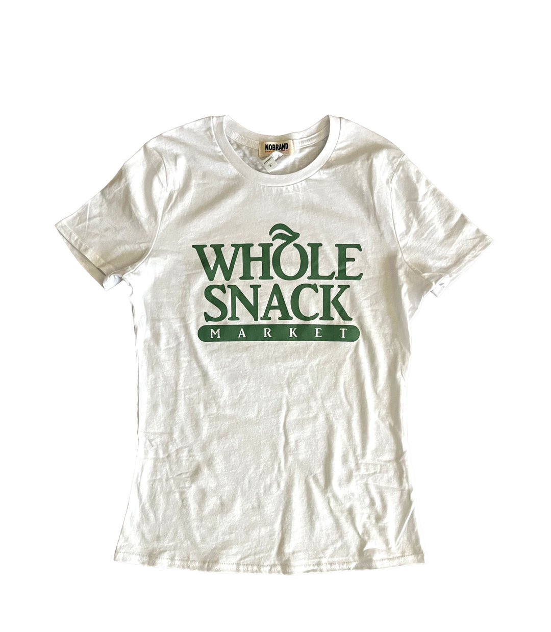a white t - shirt that says whole snack market