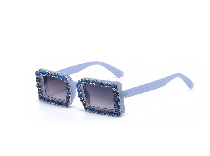 a pair of sunglasses with blue crystals on them