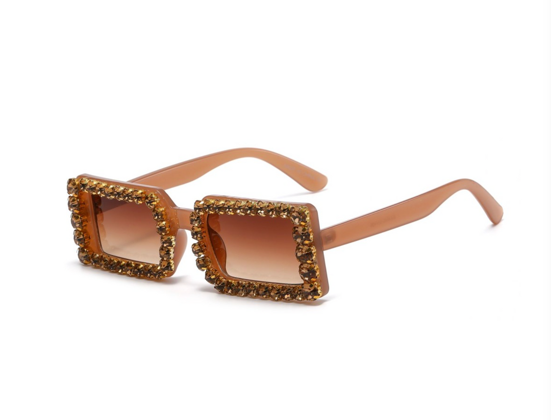 a pair of sunglasses with a brown frame