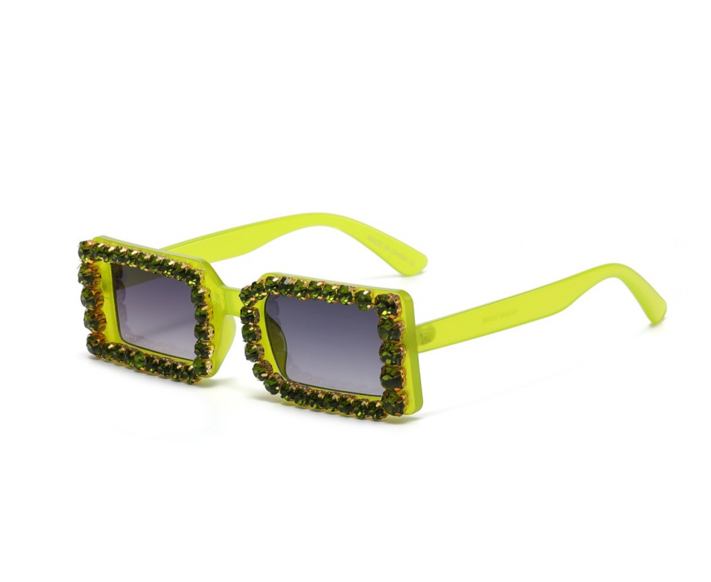 a pair of sunglasses with yellow frames and beads