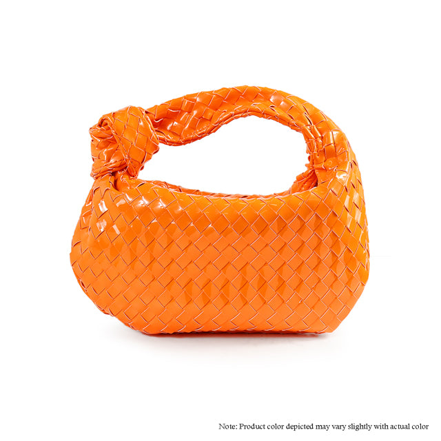 an orange woven purse on a white background