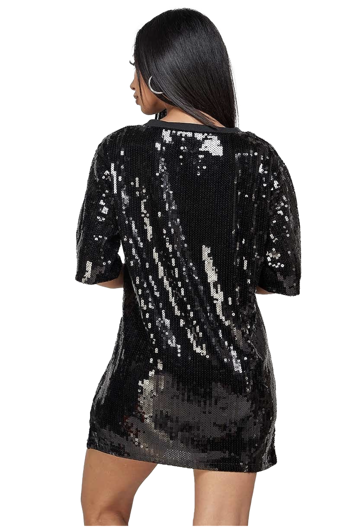 a woman wearing a black sequinned dress